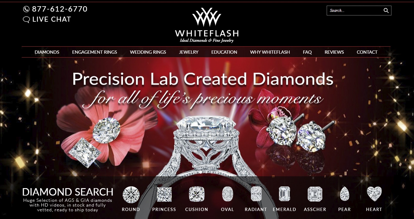 Banner image promoting precision lab-created diamonds with the tagline 'for all of life’s precious moments.' The image features sparkling lab-grown diamonds in various cuts, including round and princess, alongside an ornate engagement ring and diamond stud earrings. Floral accents and a deep red background with golden sparkles complete the design.
